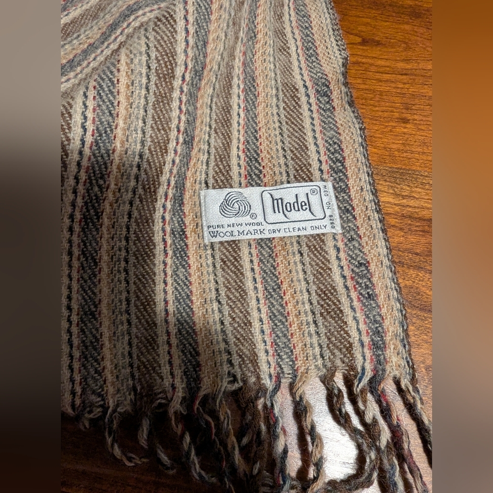 Model Woolmark Scarf Striped Wool Scarf with Fringe. Earth Tones.